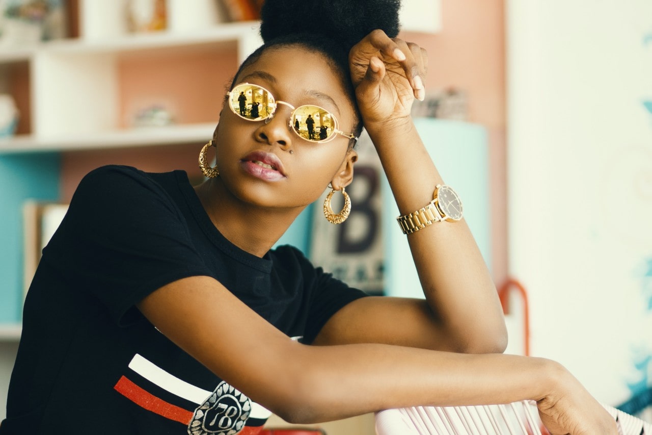 A fashionable young woman wearing a luxurious wristwatch.