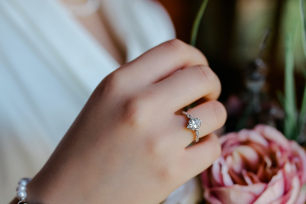A marquise engagement ring on a bride’s hand