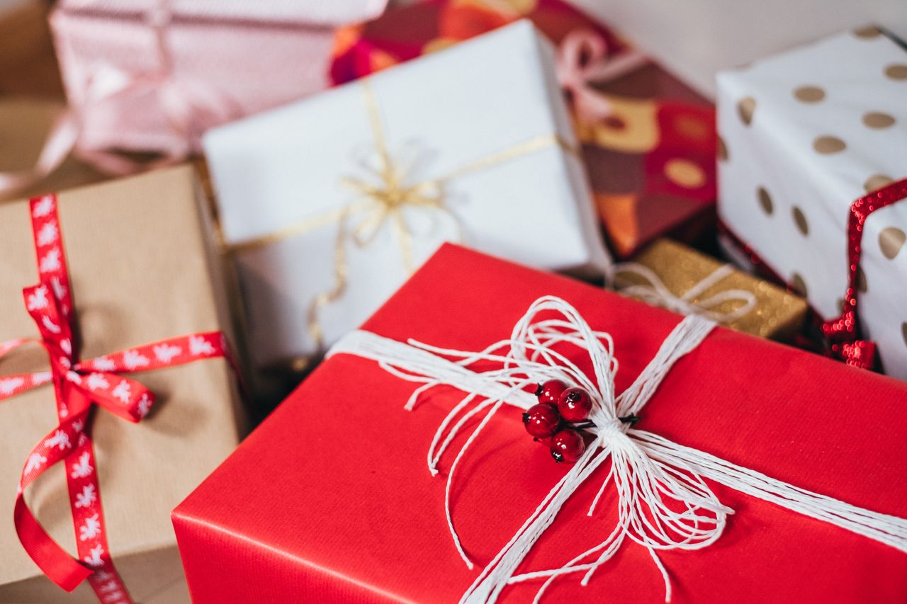 A close-up of a selection of festively wrapped Christmas gifts.