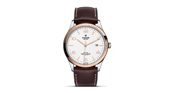 A mixed metal TUDOR watch with a brown leather strap, available at Exclusively Diamonds.