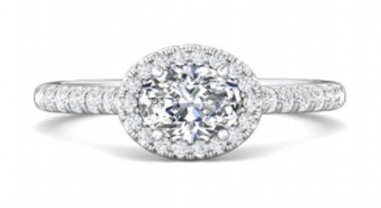 a white gold halo set engagement ring with an east west orientation center stone